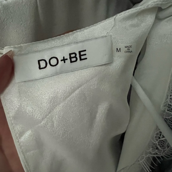 DO + BE white jumpsuit with eyelash lace trim, v neck, belt, and 2-button back. - Picture 2 of 4